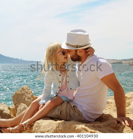 Father and Daughter Playing Together at the Beach. Summer vacation