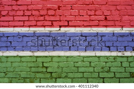 Flag of Gambia painted on brick wall, background texture