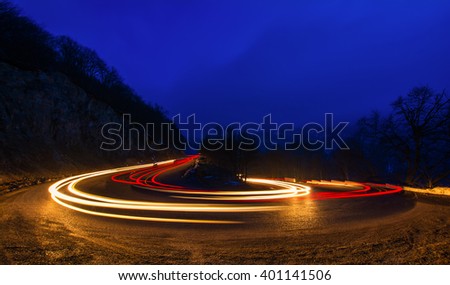 car light trails on a winding road at night in Dilijan, Armenia