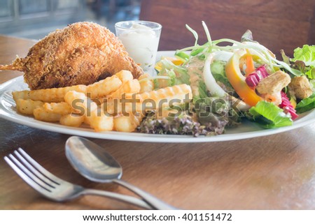 Deep fried chicken meat with organic salad, stock photo