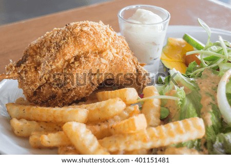 Deep fried chicken meat with organic salad, stock photo