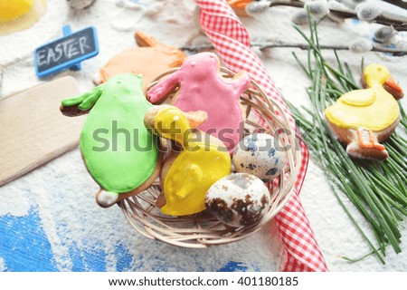 Easter background.Easter cooking.Easter cookies , willow branches on wooden background.Place for text.