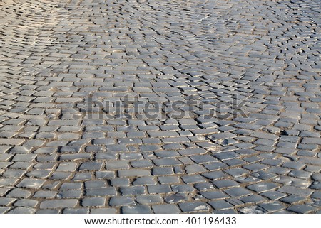 Pavement flag-stone slate outdoor floor surface covering closeup on dark grey stone background