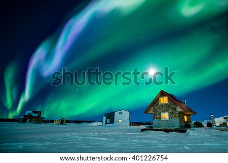 An amazing night display colorful aurora borealis at Great Slave Lake Royalty-Free Stock Photo #401226754