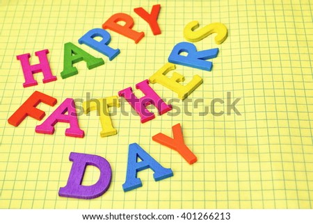 Happy Fathers Day Colorful Sign On Yellow Page Background, Holiday or Celebration Concept, Closeup, Macro, Detail