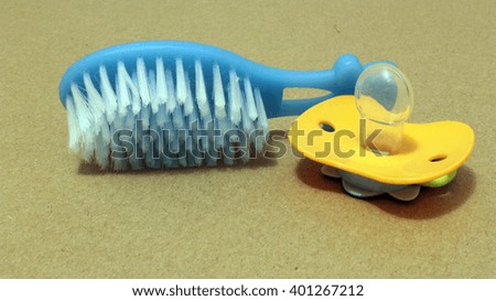 Comb and Baby's Dummy
