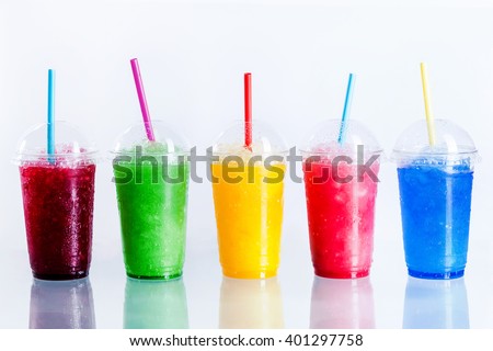 Panoramic Still Life of Colorful Frozen Fruit Slush Granita Drinks in Plastic Take-Away Cups with Lids and Drinking Straws in front of White Background Royalty-Free Stock Photo #401297758