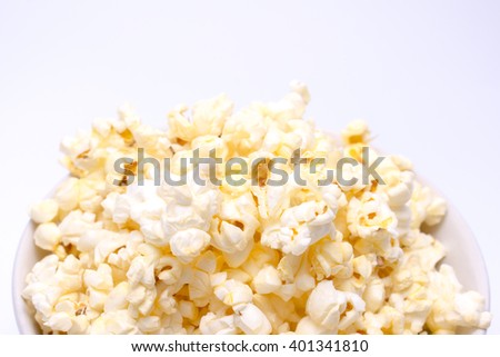 Close up of popcorn on white background