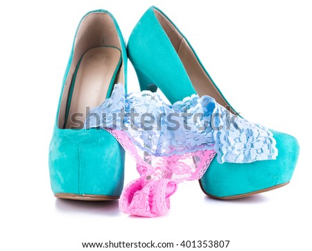 Fashion beautiful women's high-heeled shoes and blue women's panties on a white background