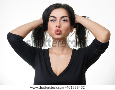 Beautiful teen girl making funny silly face isolated on white Royalty-Free Stock Photo #401356432