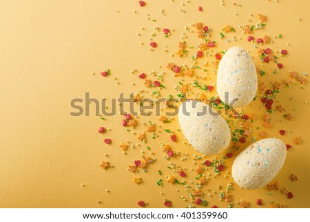 Yellow easter egg on yellow background