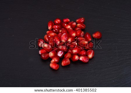 Corn Ripe Pomegranate on dark background. Studio Photo