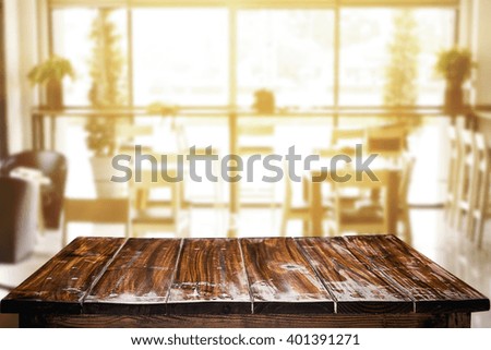 Desk space platform with blurry background of restaurant vintage tone for product display montage.