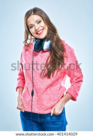 Young woman casual style  dressed portrait with headphones. Music style. Studio isolated.