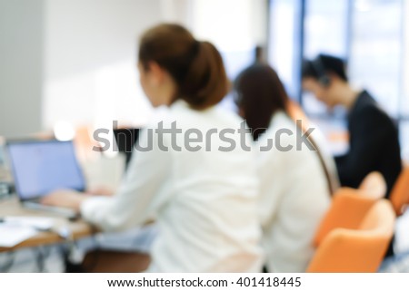 abstract blurred group of asian employee work as call center in office operation room. Royalty-Free Stock Photo #401418445