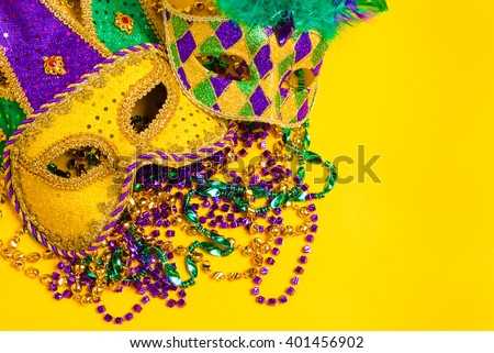 A group of mardi gras mask with beads