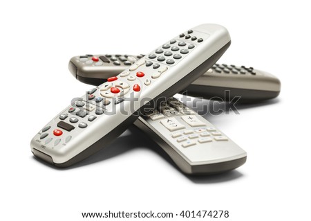 Pile of TV Remote Controls Isolated on White Background.