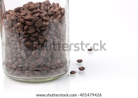 Roasted coffee beans in a jar. white back ground