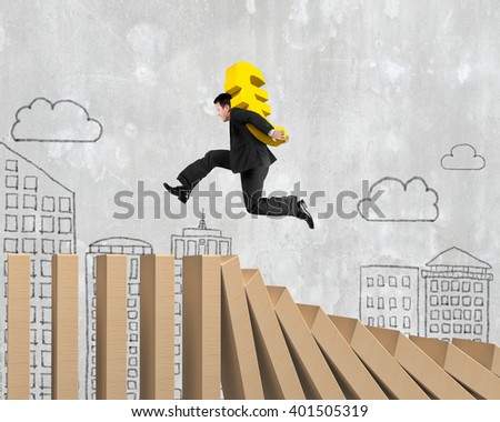 Man carrying golden Euro sign running on falling wooden dominos, with doodles concrete wall background.
