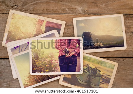 Travel photo album of remembrance and nostalgia on wood table. instant photo of camera - vintage and retro style