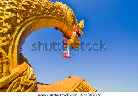 Head of naga statue with the sky Background