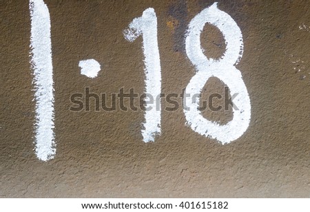 Number eighteen typed on the metall plate