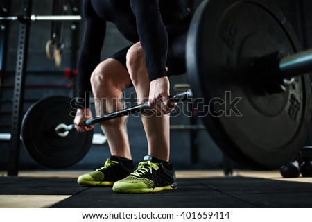 Training with barbell Royalty-Free Stock Photo #401659414