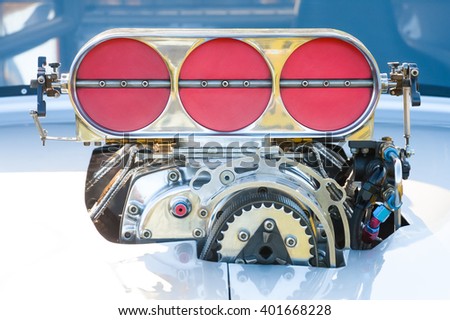 powerful blower supercharger on a high performance racing vehicle Royalty-Free Stock Photo #401668228