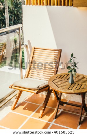 Empty chair and table around outdoor deck - Vintage Light Filter