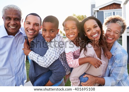 Outdoor group portrait of black multi generation family Royalty-Free Stock Photo #401695108