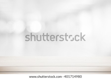 White table background over blur bokeh light for product display, White wood desk, counter, shelf surface backdrop, Empty wooden table top over blur kitchen room background for food banner, template