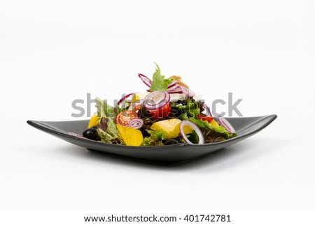 Picture of delicious greek salad on black dish