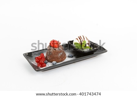 Picture of delicious chocolate fondant with ice cream and fruits