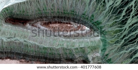 eye of velociraptor, abstract photography of the deserts of Africa from the air. aerial view of desert landscapes, Genre: Abstract Naturalism, from the abstract to the figurative, contemporary photo a