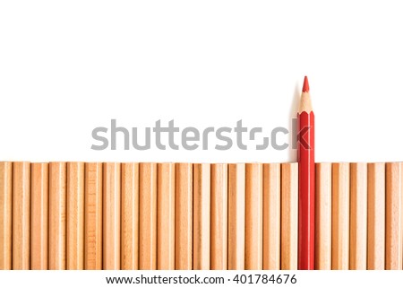 Sharp red color pencil stand out of group of brown pencils on white background - business concept of leader and success