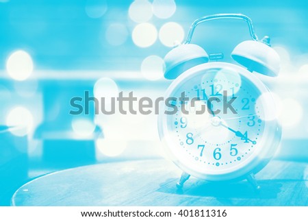 Retro alarm clock on abstract bokeh light,soft color,vintage background