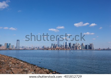 This image contains views of Jersey City and Manhattan, from Liberty State Park. You can see Goldman Sachs Tower, 432 Park, Empire State Building, Freedom Tower, Ellis Island, and the Brooklyn Bridge.