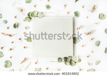 white wedding or family photo album, dry and fresh branches isolated on white background. flat lay, overhead view