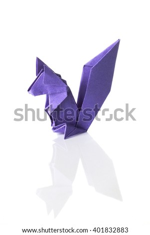 A squirrel origami made of purple paper isolated on white background.