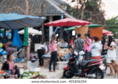 motion blur of many people shopping in fresh market
