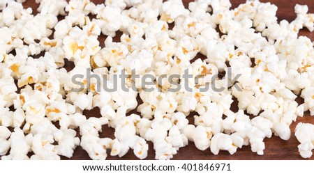 Closeup pile of white fluffy popcorn lying mixed together