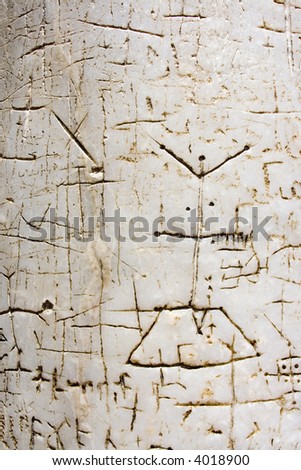 Inscriptions and pictures of pilgrims on an ancient marble pillar of Church of the Holy Sepulcher, Jerusalem
