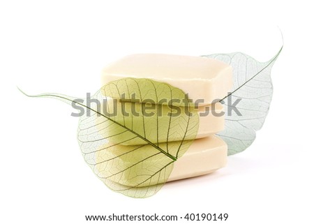 Soap with a green leaf on the white isolated background