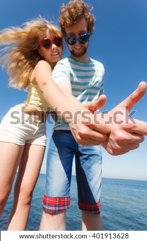 Happiness dating concept. Couple in love blonde woman bearded man enjoy date, making thumb up hand gesture outdoor, wide angle view