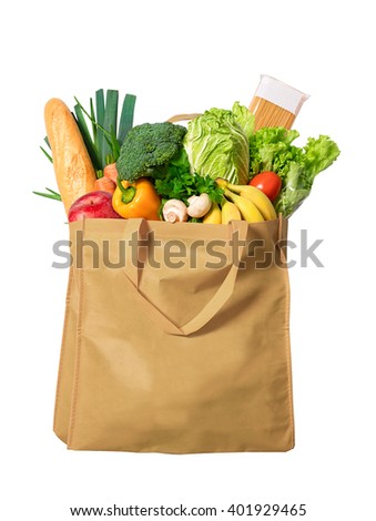 Eco friendly reusable shopping bag filled with vegetables Royalty-Free Stock Photo #401929465