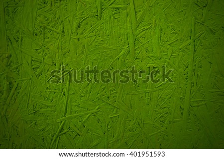 the background texture made of pressed wood has a beautiful pattern of green hue