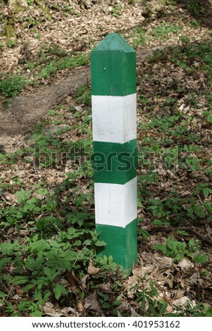 Wooden poles green white
