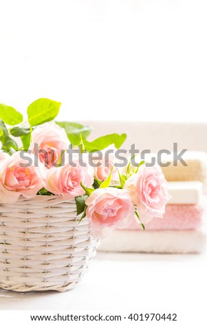 Beautiful, pink roses in a white basket close up 