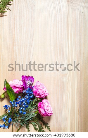 Stylish branding mockup to display your artworks. light wood with flowers and blank letter. Cute vintage mock up on wooden background.
