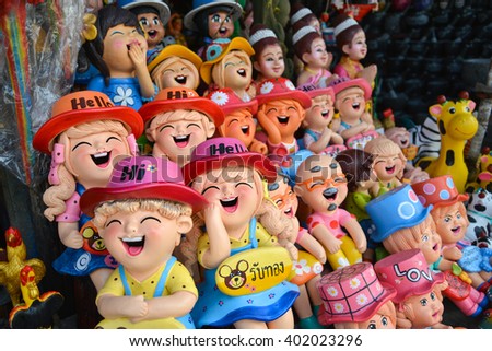 Smiling and laughing clay doll, Happiness concept.